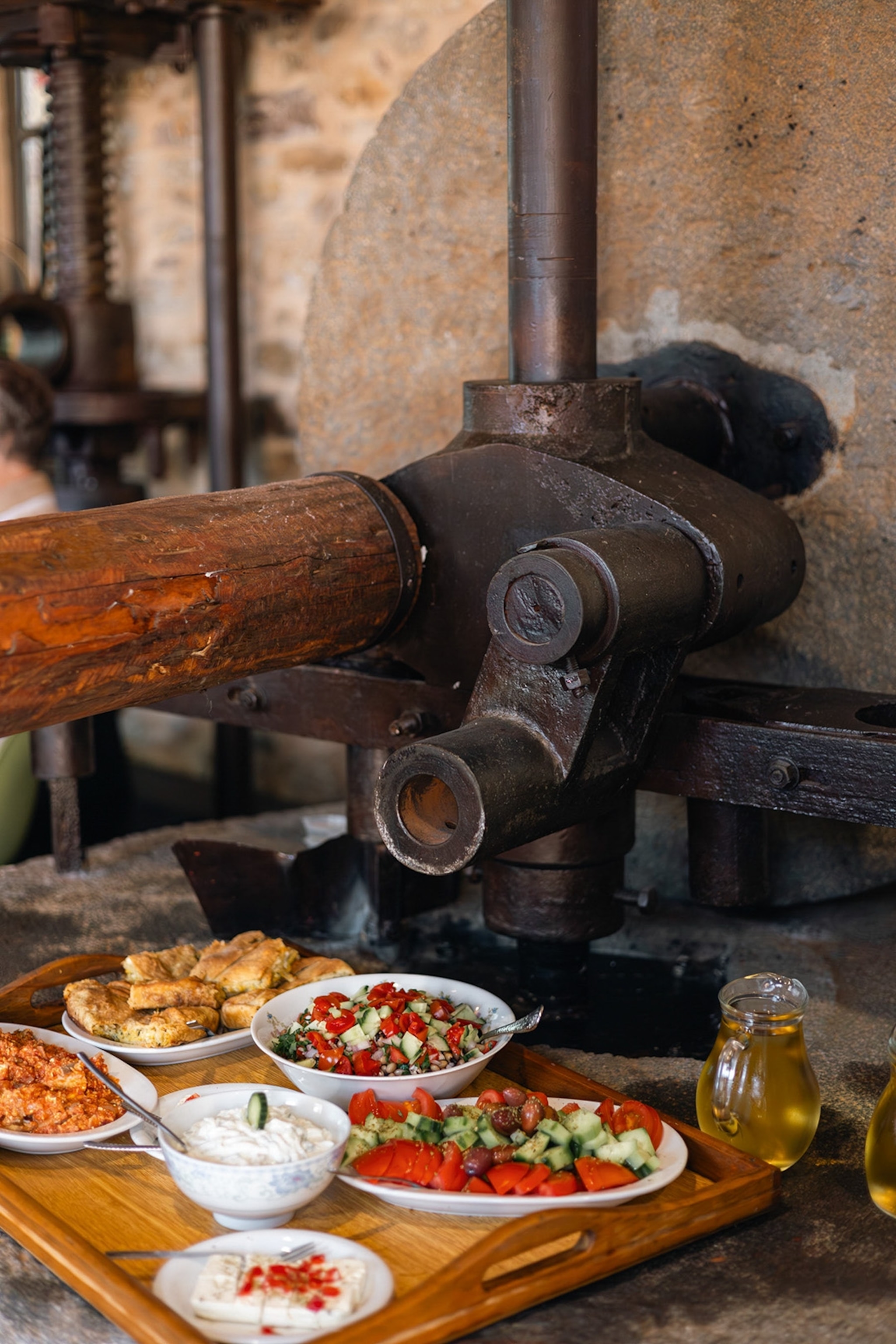 A feast of Greek fare served on a tray from an Olive Routes tour.