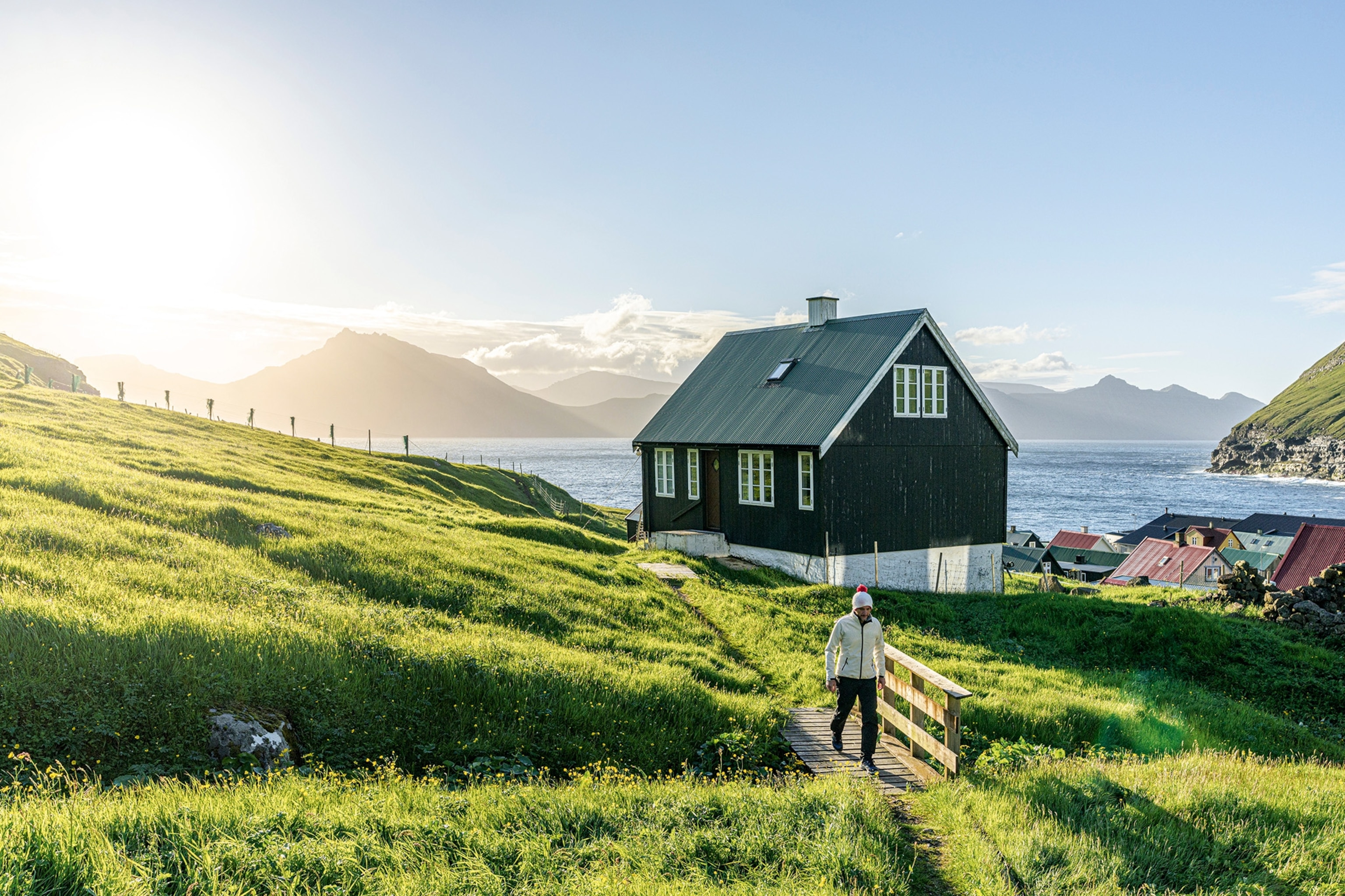 A house in Gjógv outlooks the village's long inlet that runs to the sea