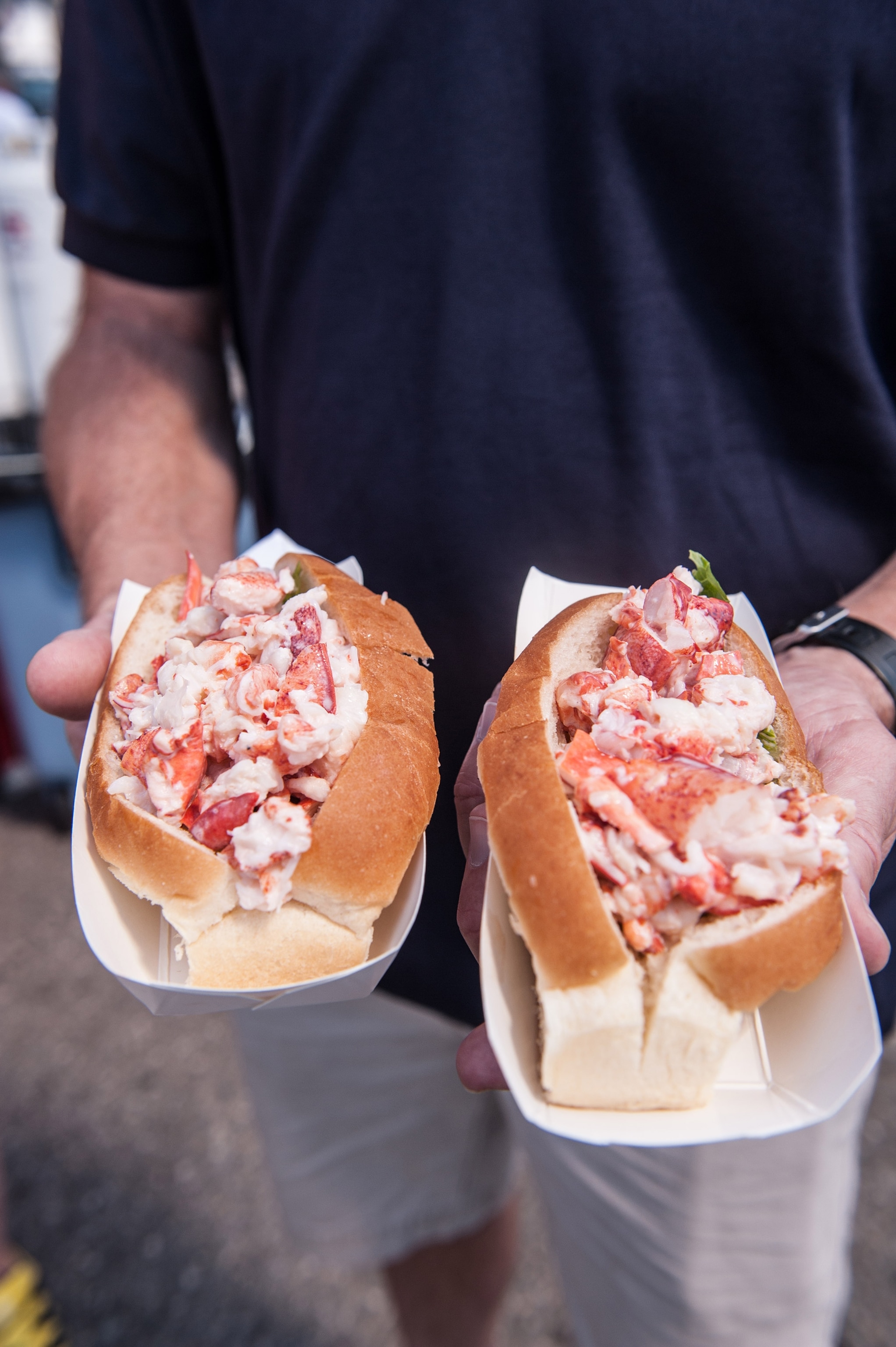 Two overstuffed lobster rolls at the Maine Lobster Festival in Rockland, Maine