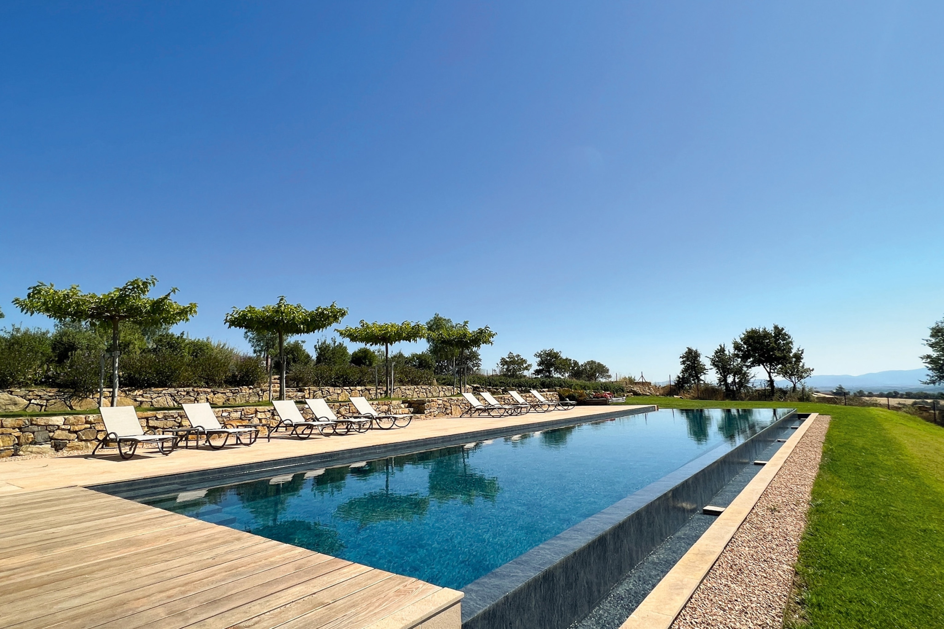 The large infinity pool stretches in the distance at Sartomare private retreat.